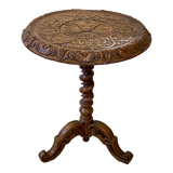 Carved wooden pedestal table