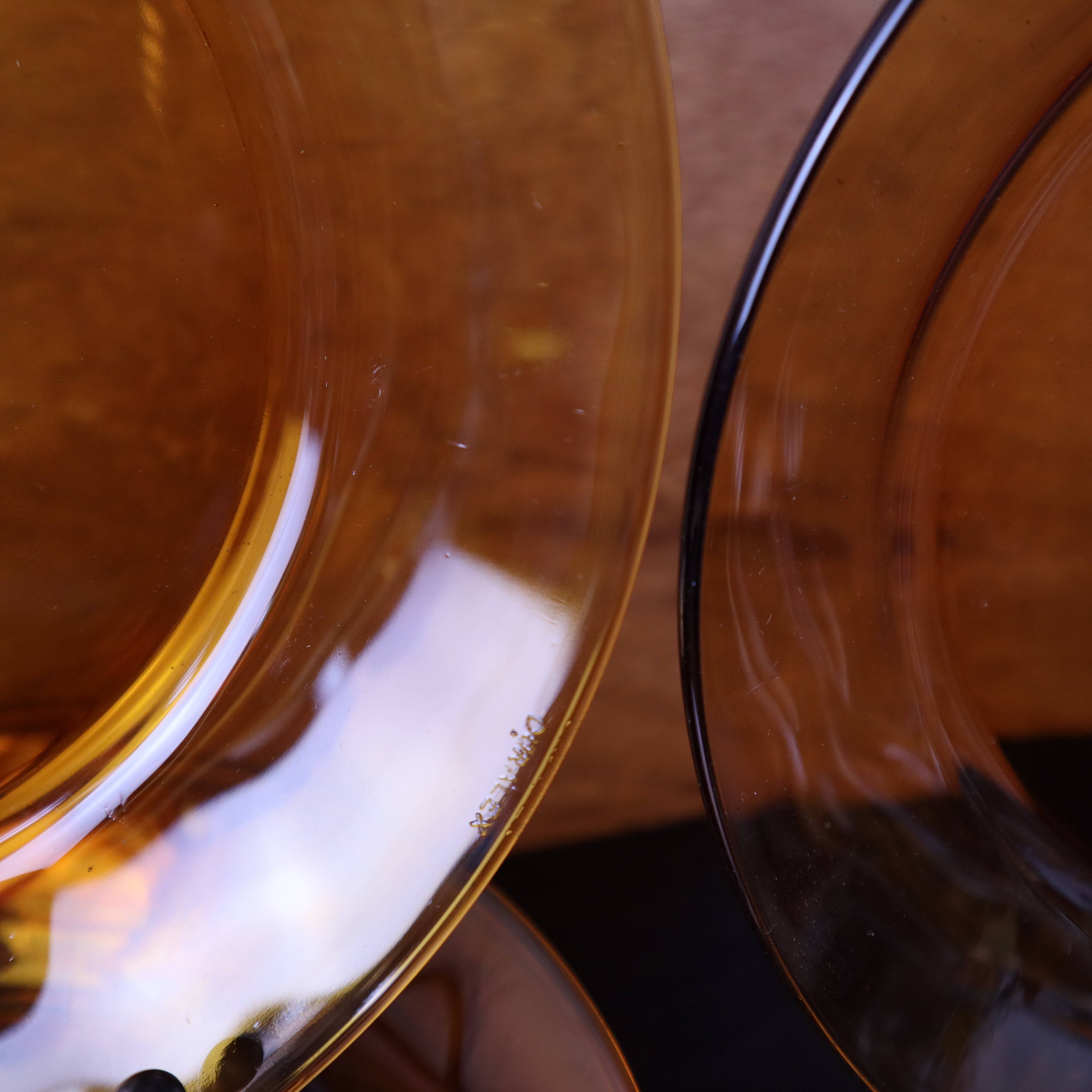 Set of 7 amber Duralex deep plates.