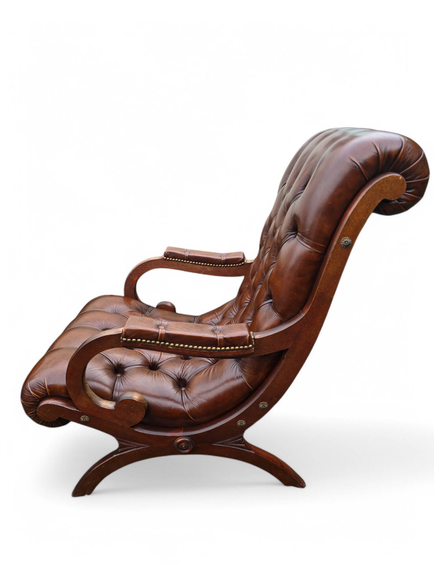 Pair of leather Chesterfields and footstools