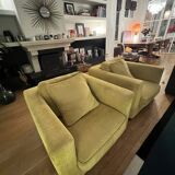 Two yellow Roche Bobois Longislande armchairs.