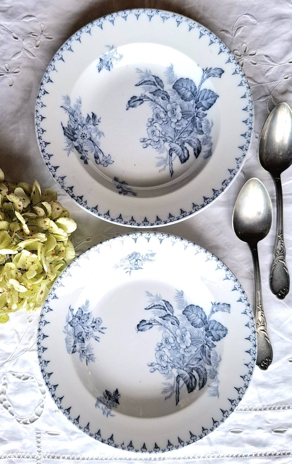 Antique mismatched earthenware soup plates with a tureen
