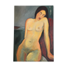 Female nude table on red armchair
