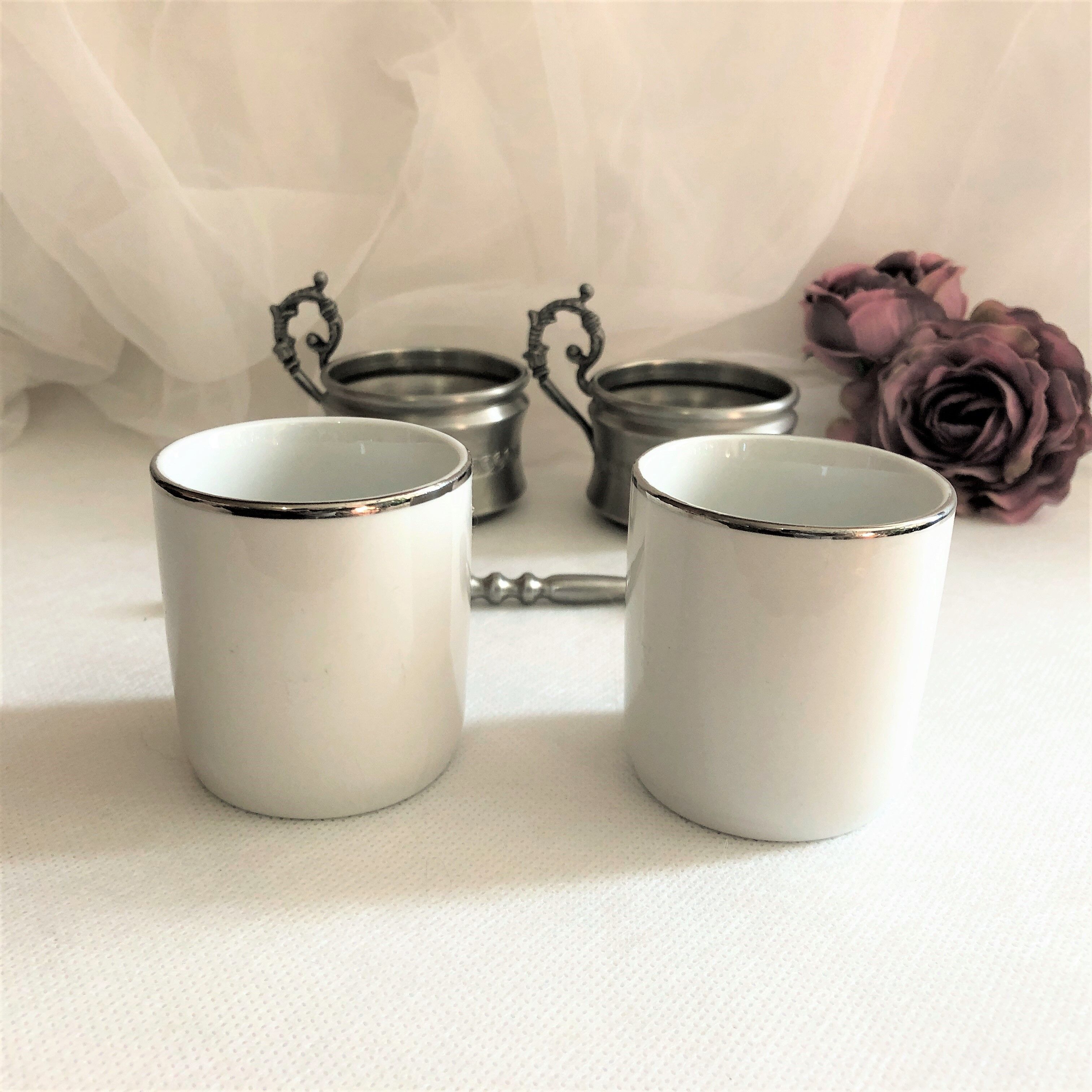 Set two porcelain cups with pewter support