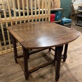 Wooden table with gateleg flaps