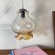 Vintage tulip-shaped portable lamp in transparent glass and gold.