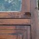 Oak entrance door and its frame and transom, wrought iron gates