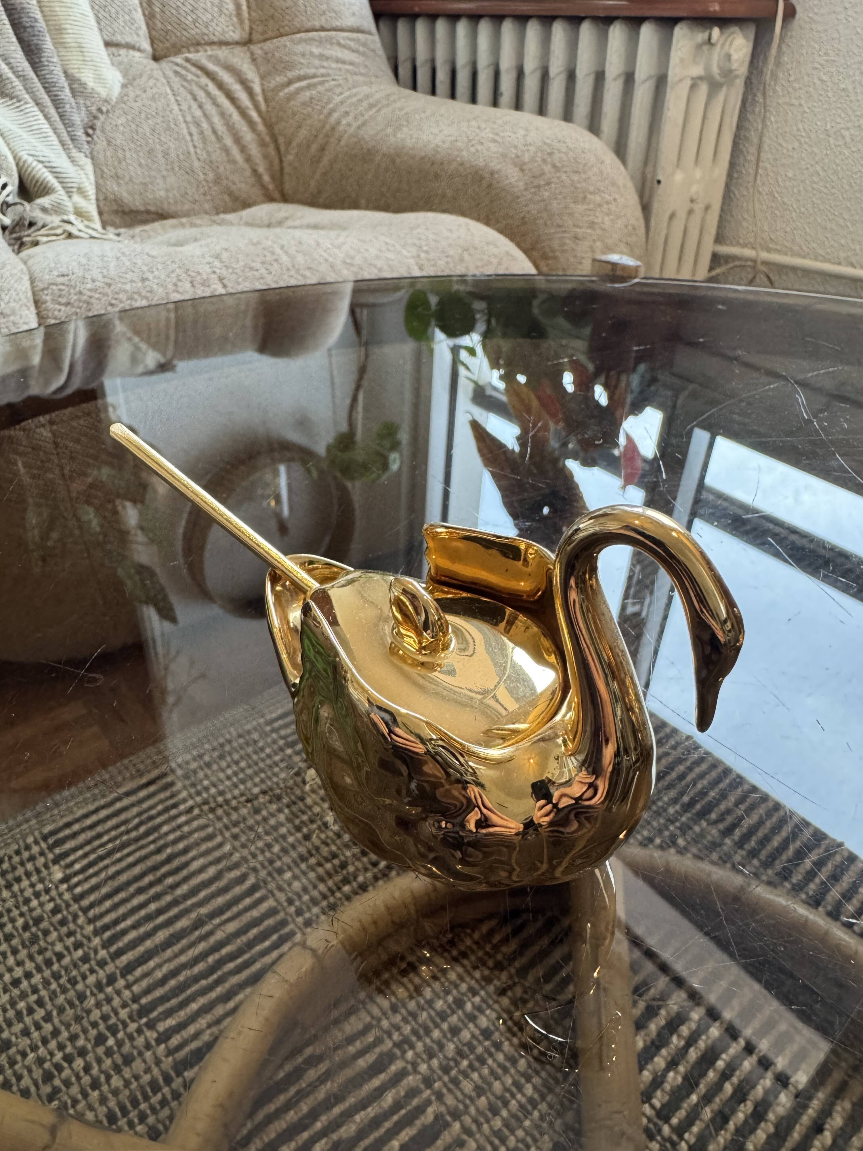 Pair of golden salt cellars in Limoges porcelain shaped like swans