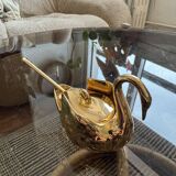 Pair of golden salt cellars in Limoges porcelain shaped like swans