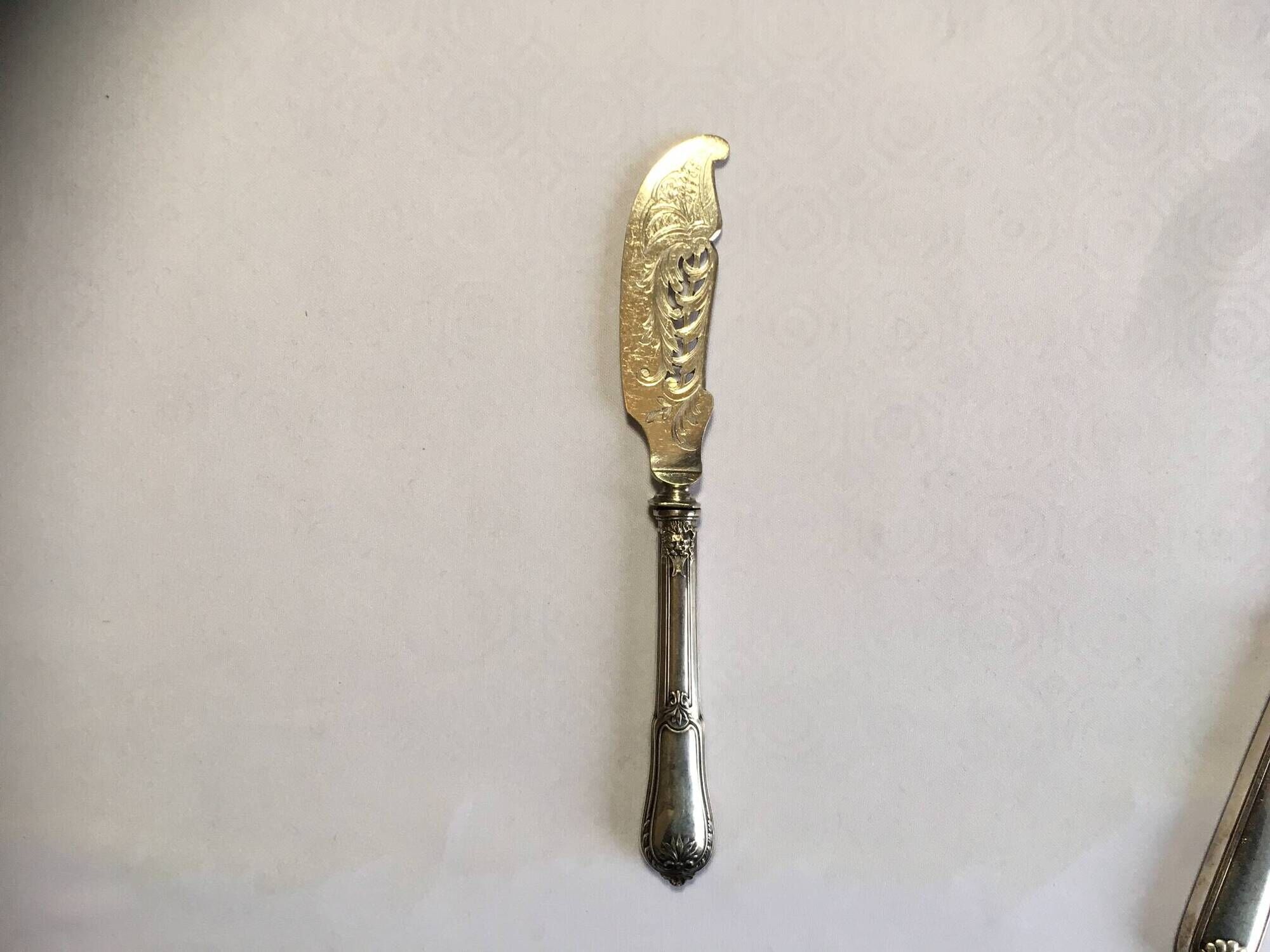 Silver-plated cheese knife with finely chiseled blade, 1900s