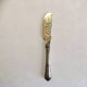 Silver-plated cheese knife with finely chiseled blade, 1900s