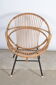 Rattan shell armchair with armrests