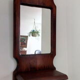 Wooden wall mirror with its shelf