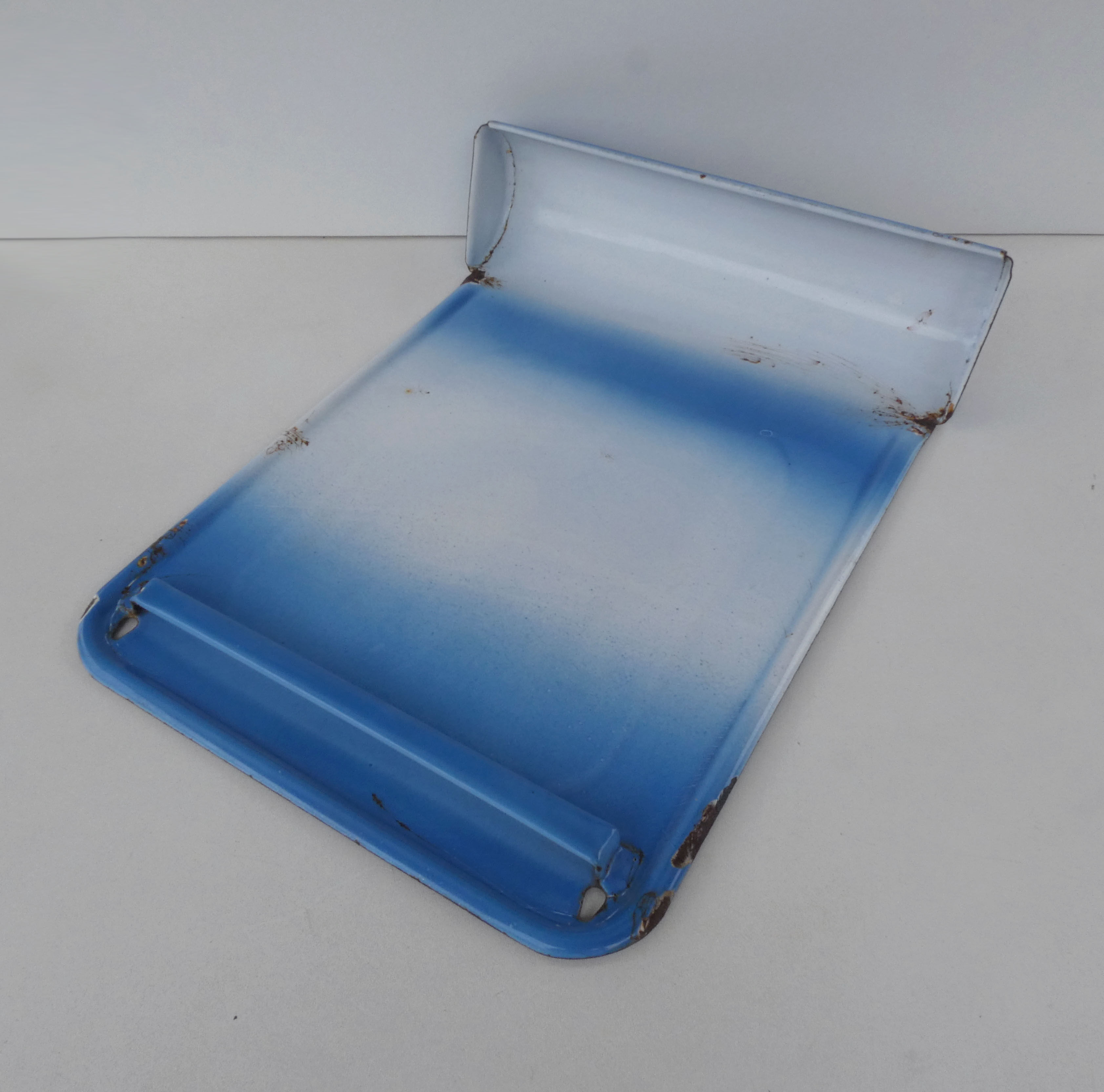 old blue enamelled steel utensil drainer