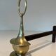 Pair of Bronze Chenets in Neoclassical Style in the Form of an Oil Lamp