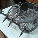 Pair of carved metal wall lamps signed RG