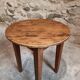 Antique round side table with oak legs and a pine top, circa 1900.