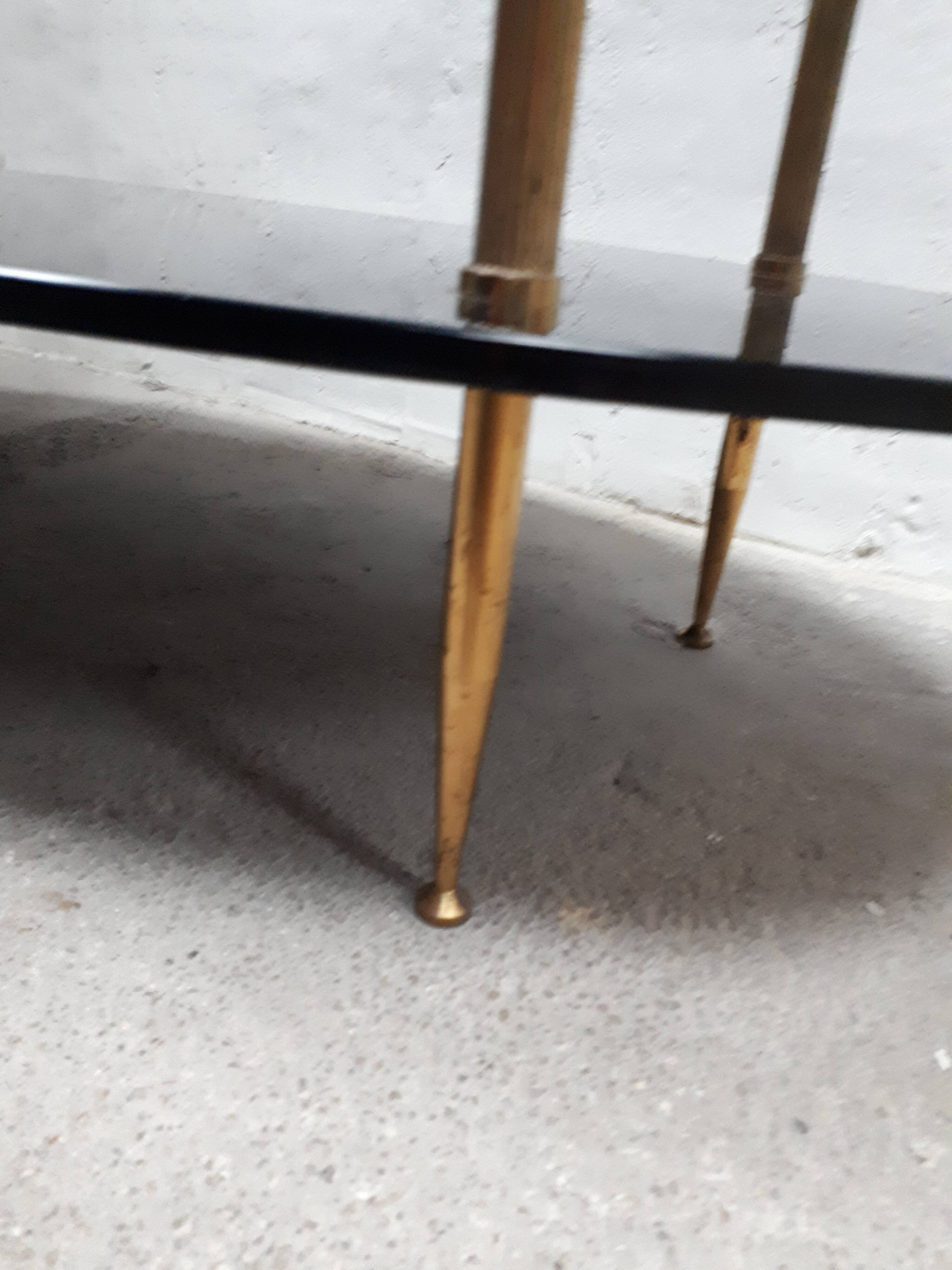 Oval coffee table black glass and vintage 1960 vintage gilded brass feet