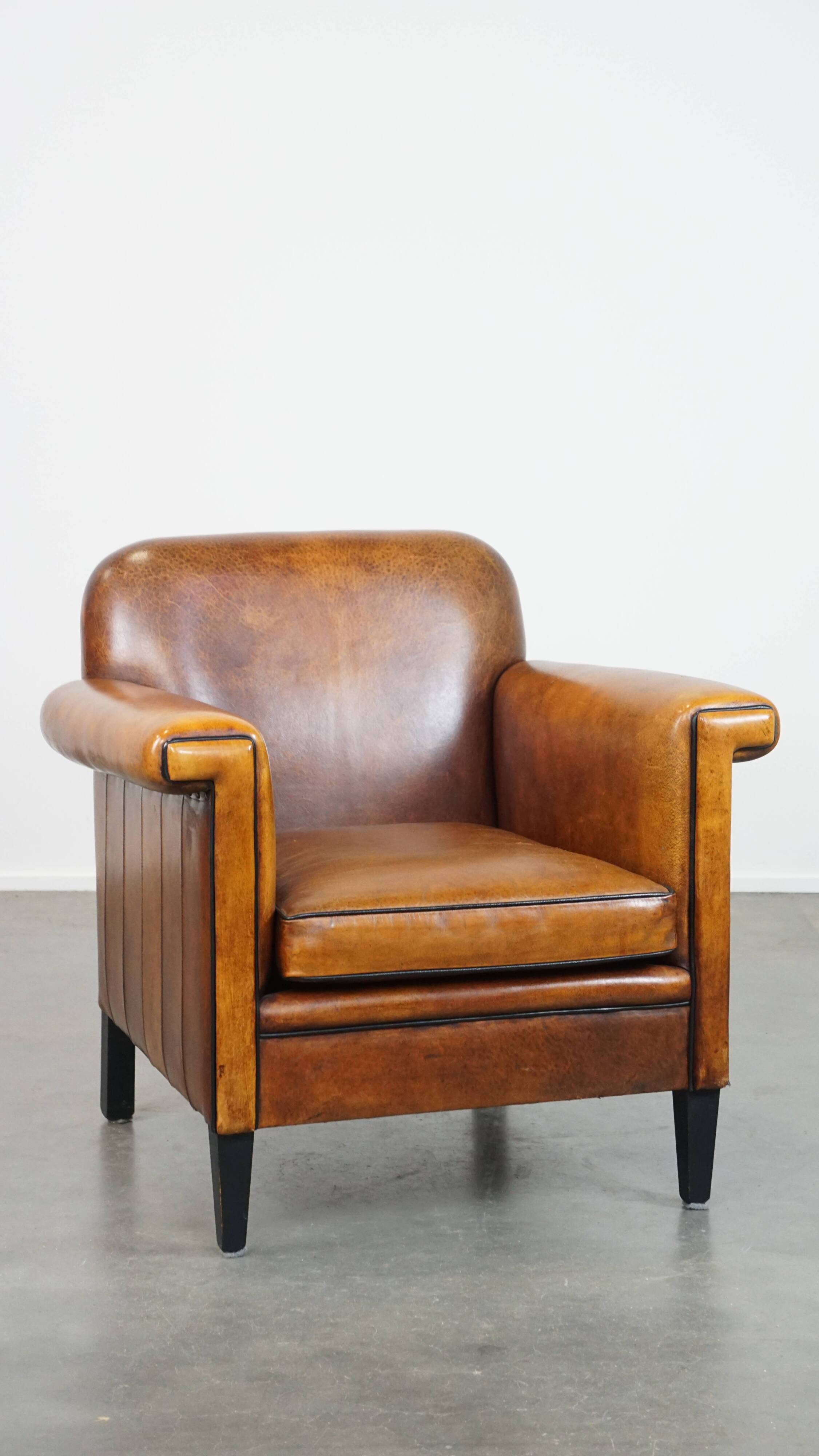 Sheep leather Art Deco design armchair finished with black piping