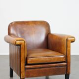 Sheep leather Art Deco design armchair finished with black piping