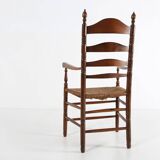 Antique wooden armchair with cane seat, France ca. 1900