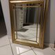 Mirror in gold and silver color