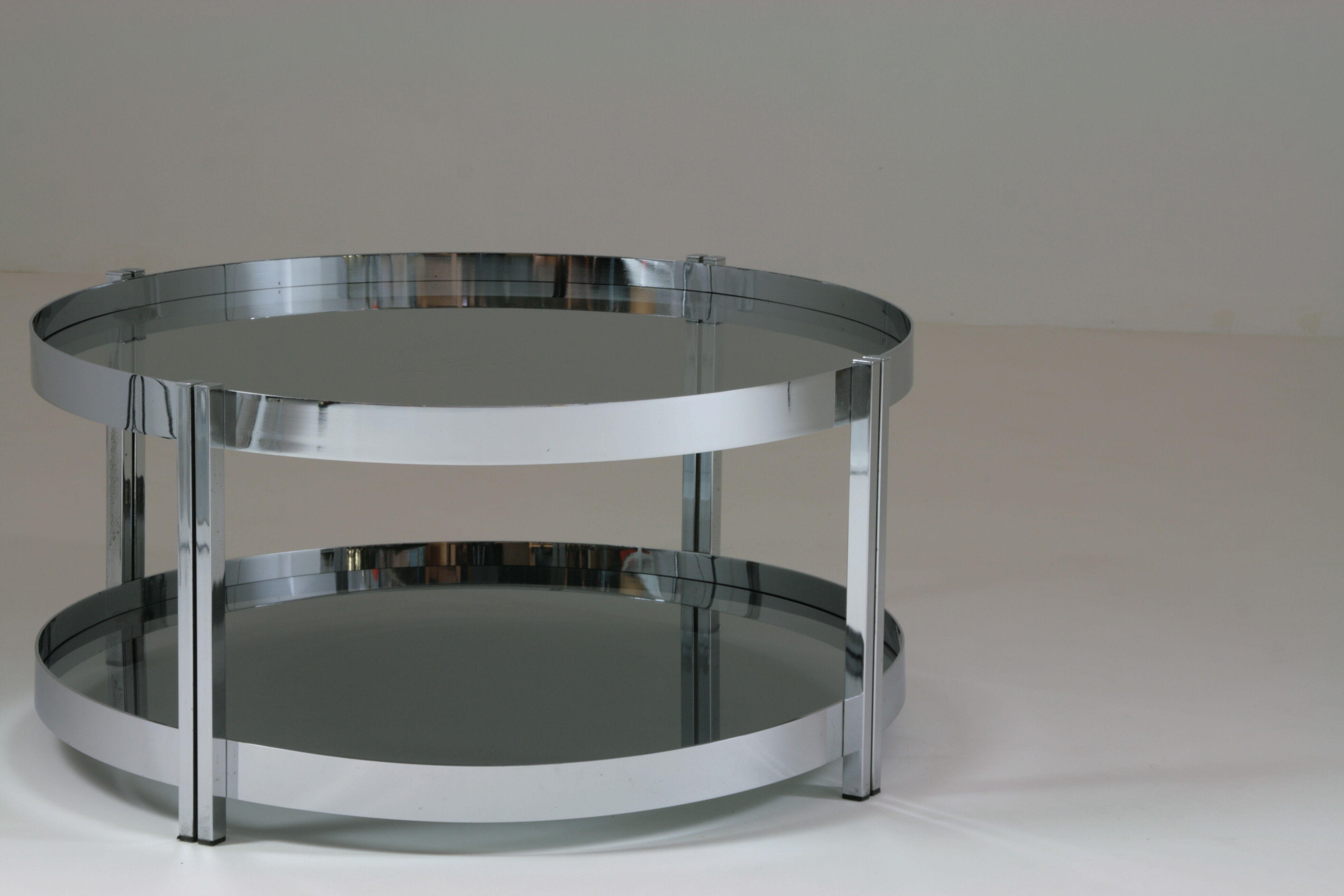 Round chrome-plated metal coffee table and smoked glass tops, France 1970s