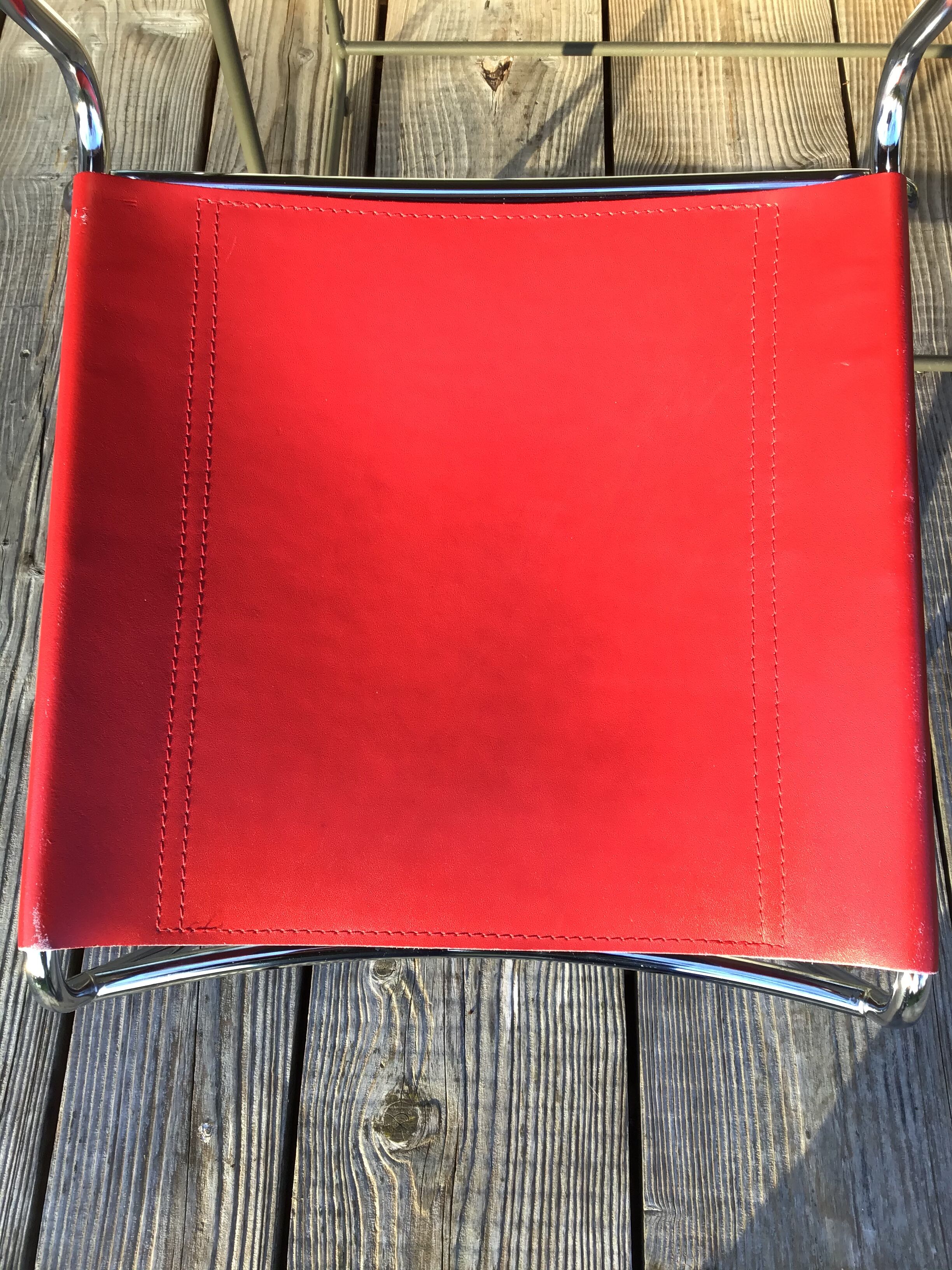 Chrome sled chair and red leather