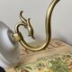 Swan neck wall light in brass with rose petal glass shade.