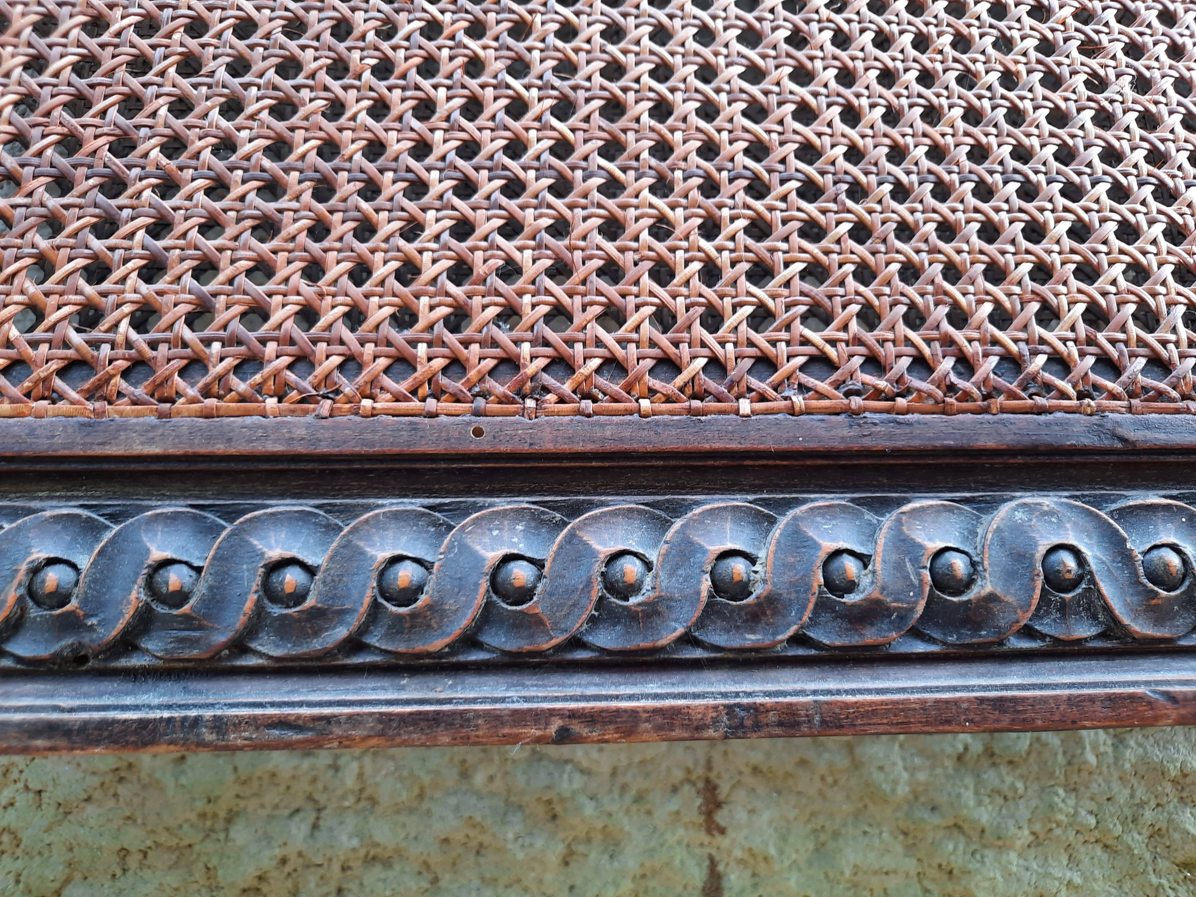 Hand-carved Louis XVI style headboards with chic vintage caning (1800s)