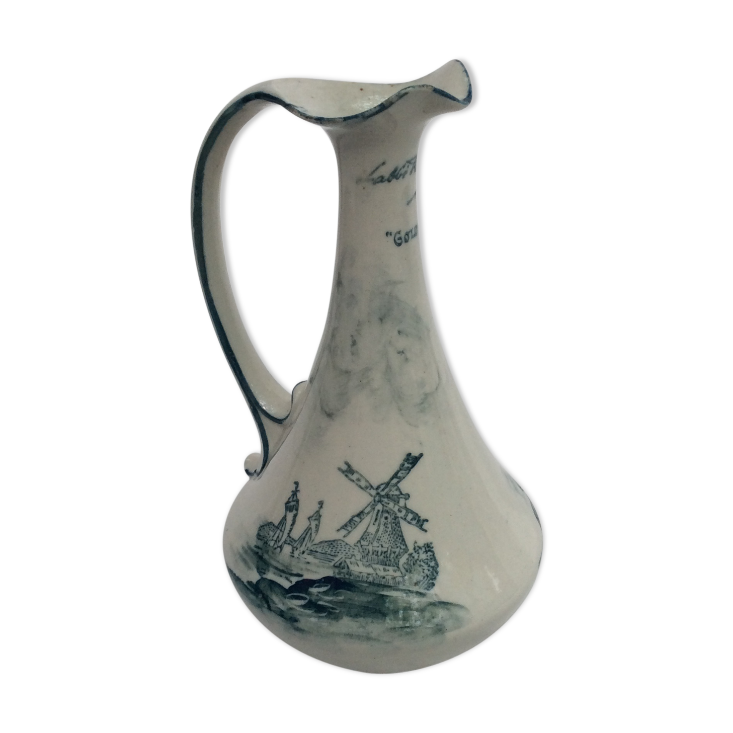 Old pitcher in Dutch-made earthenware signed