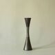 Set of three diabolo-shaped candle holders made of cast steel.