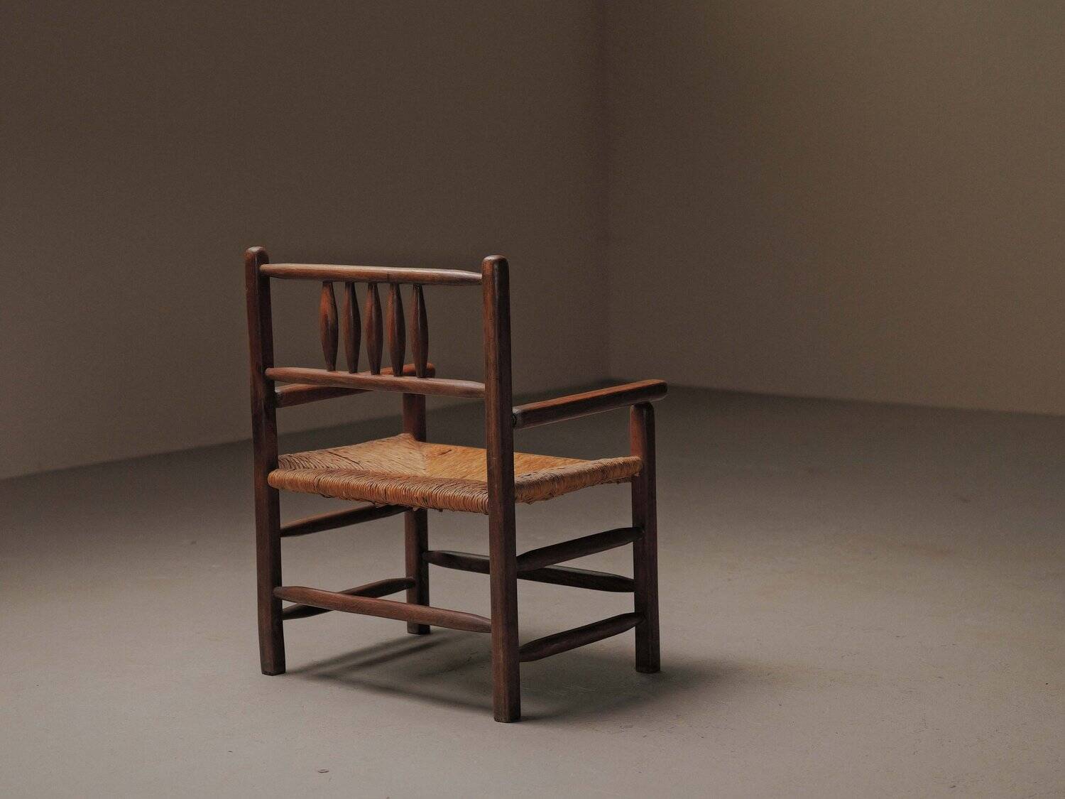 Wicker armchair in solid wood, handcrafted, France, around 1950.