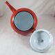 Vintage teapot coffee maker in red enameled metal