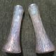 Pair of iridescent glass vases with relief decoration reminiscent of plant motifs.