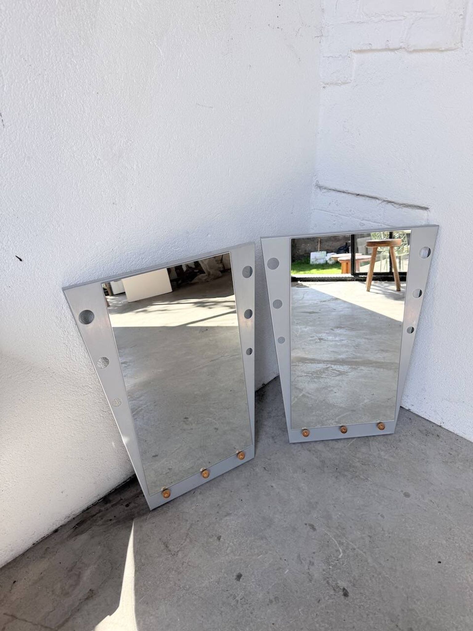Pair of "Memphis" mirrors from the 80s in chrome and wood.