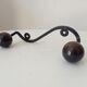 Wood and wrought iron ball coat rack from the 1950s.