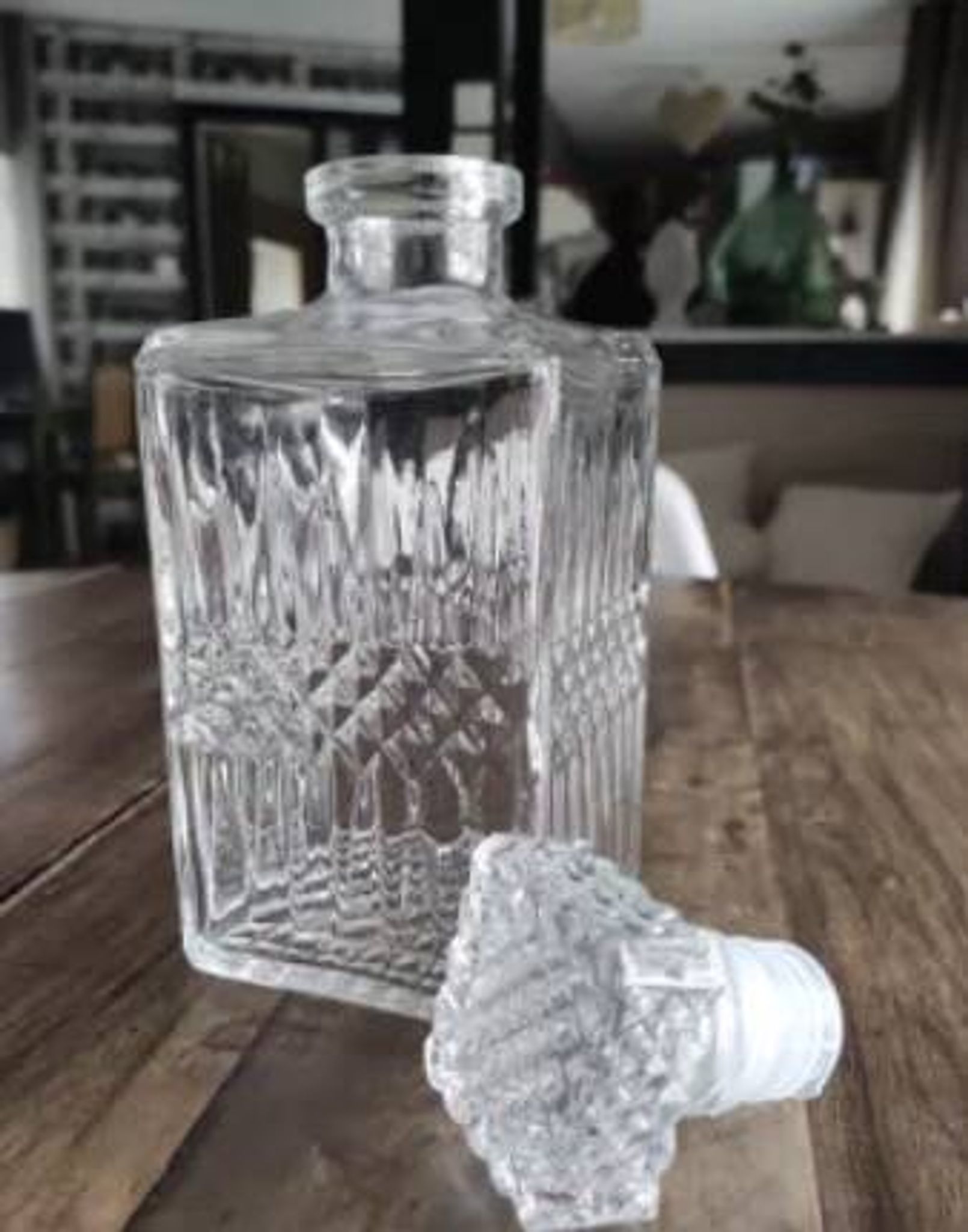 Vintage whiskey decanter in diamond faceted glass airtight stopper