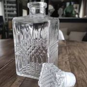 Vintage whiskey decanter in diamond faceted glass airtight stopper