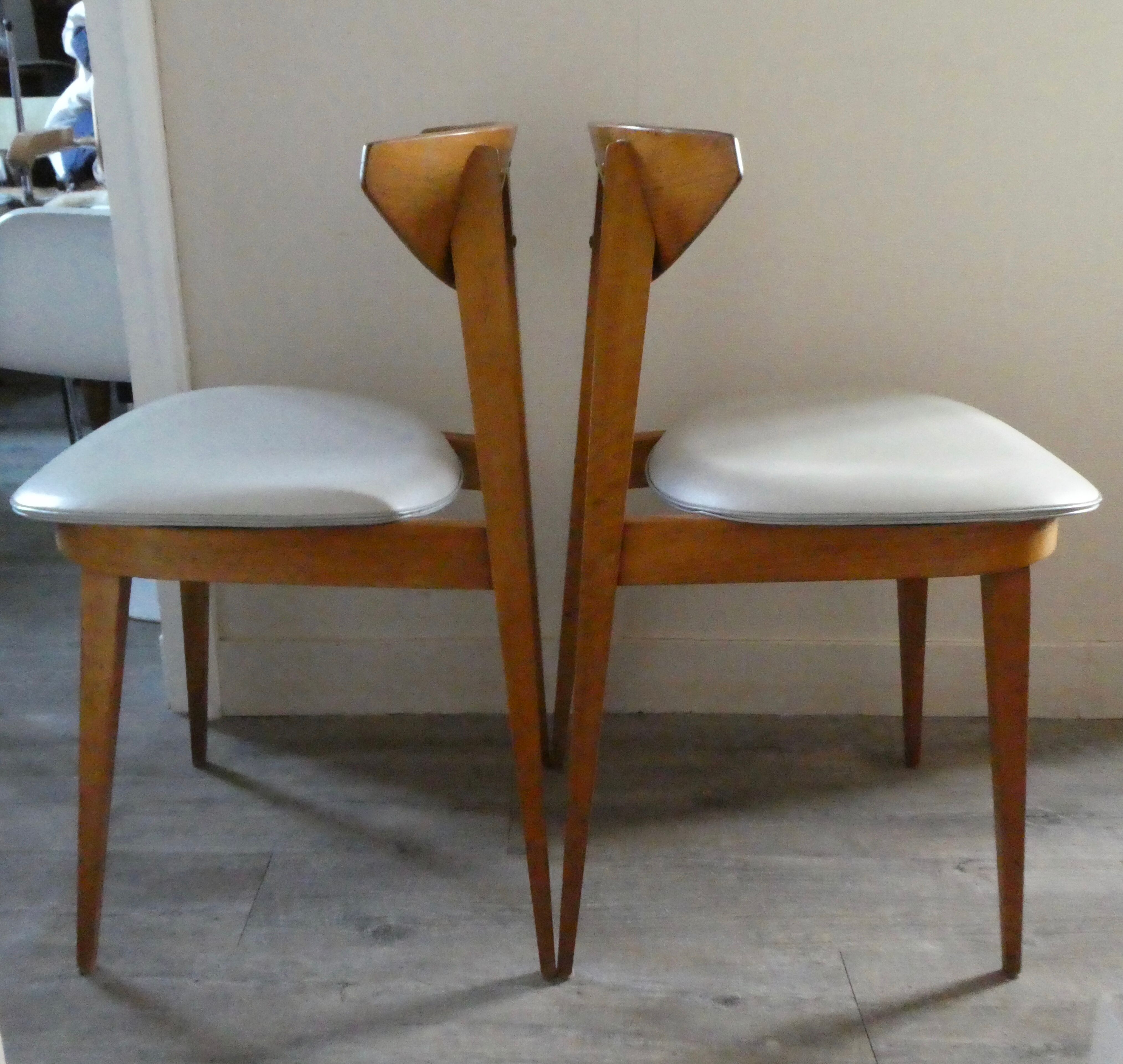 Pair of wooden chairs and skai scandinavian style