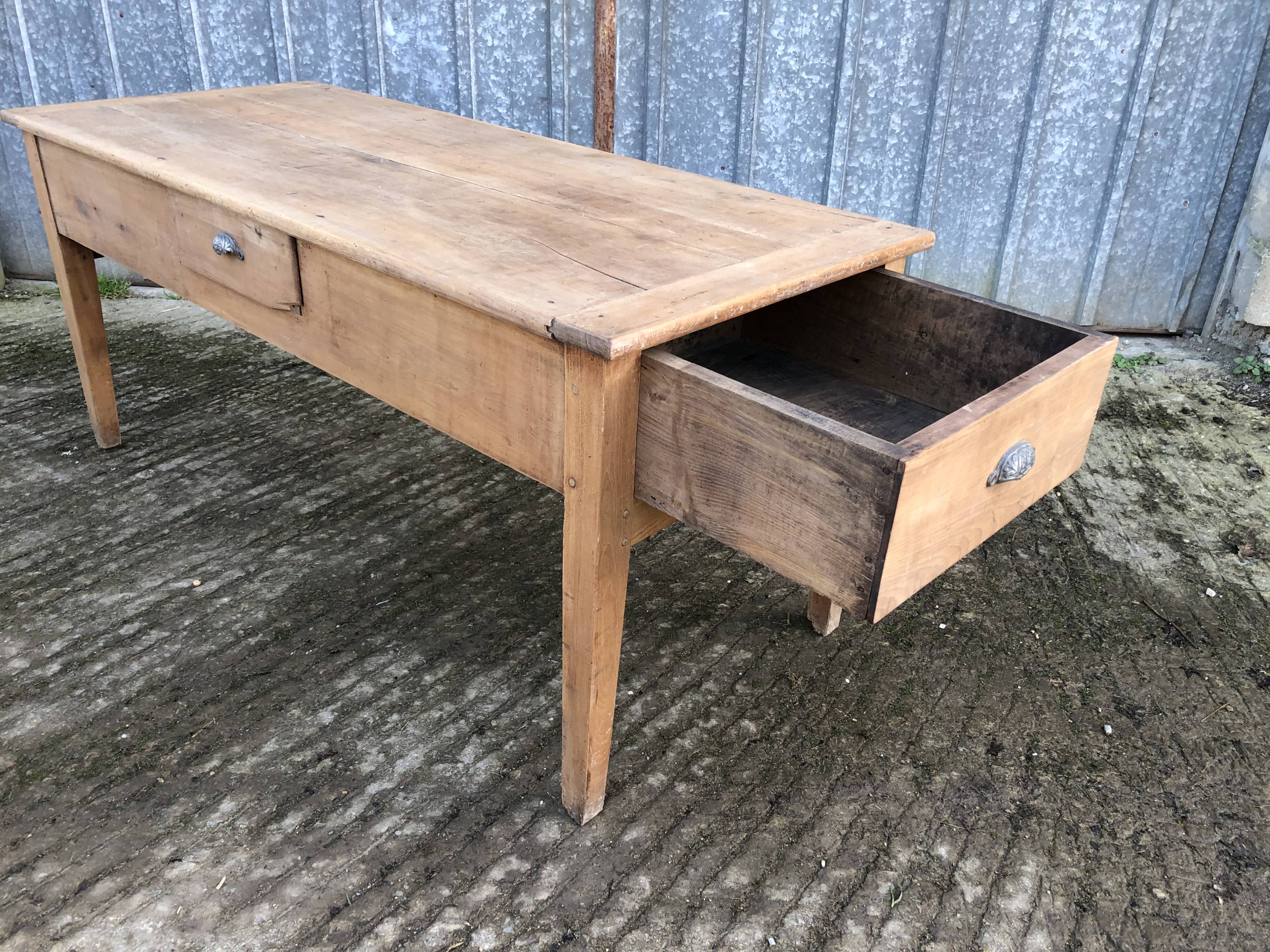 Antique solid cherry farmhouse table with 3 drawers and 1 pull out.