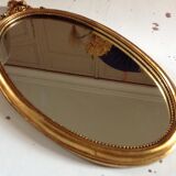Miroir médaillon en bois doré - 43x24cm