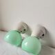 Duo of wall lamps in porcelain and green opaline