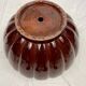 Complete in brown-toned enamelled ceramic, planter on its column