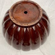 Complete in brown-toned enamelled ceramic, planter on its column