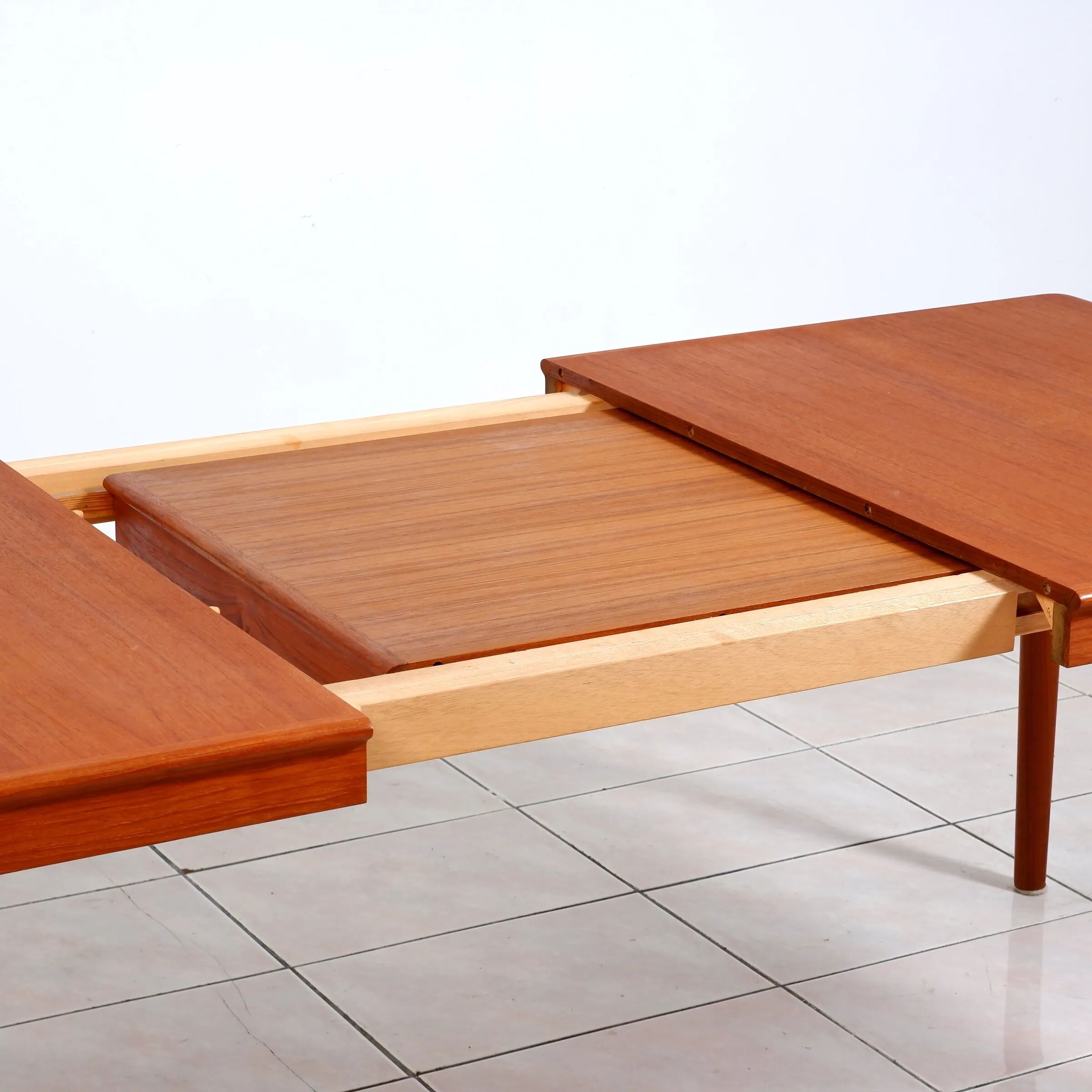 Extendable dining table in teak by H. W. Klein for Bramin Mobler