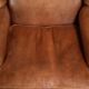 Sheepskin wingback armchair in a light cognac colour in English style