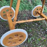 Vintage wicker cradle on casters