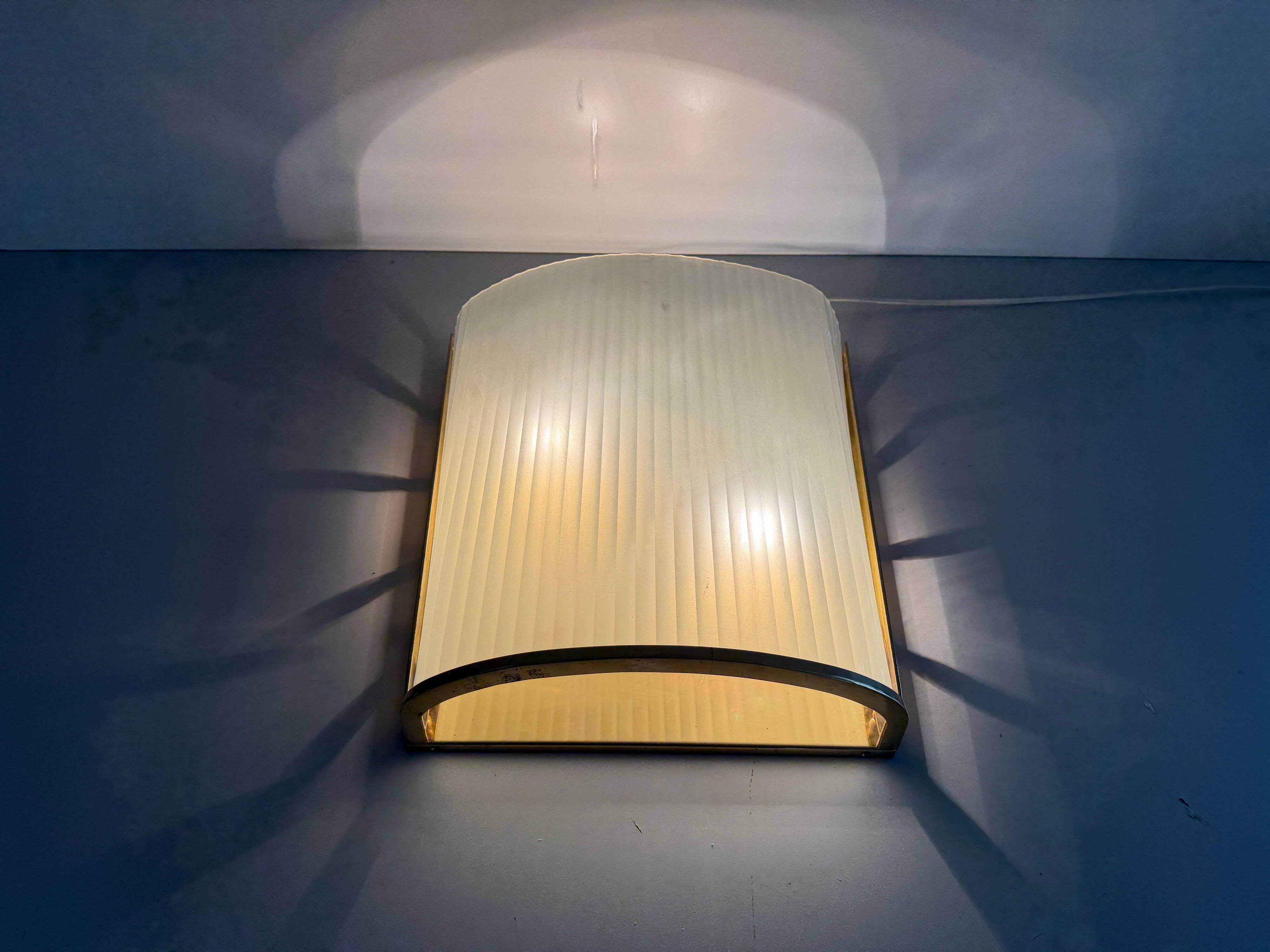 Large heavy glass wall light with a brass frame from the mid-century, 1950s, Italy.