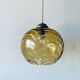 Suspension boule en verre ambré