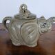 vintage ceramic teapot in the shape of a grey elephant